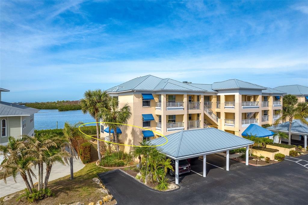 2424 Placida Road, Unit C101 Englewood, FL 34224 - Photo 2 of 65 an aerial view of a house with swimming pool and porch