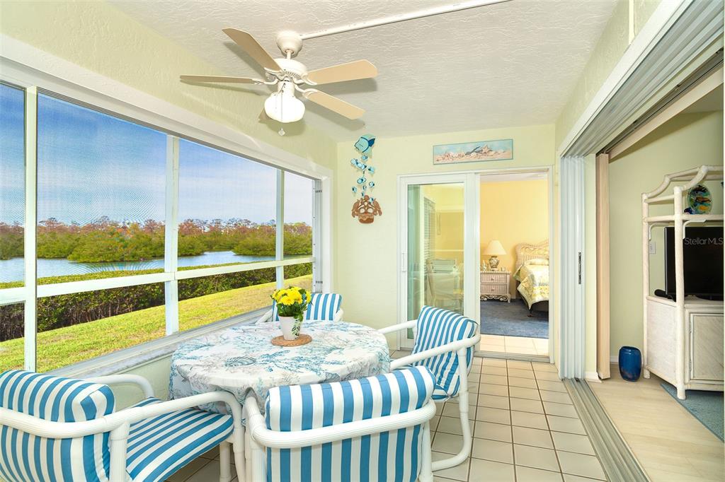 2424 Placida Road, Unit C101 Englewood, FL 34224 - Photo 22 of 65 a living room with furniture and a large window