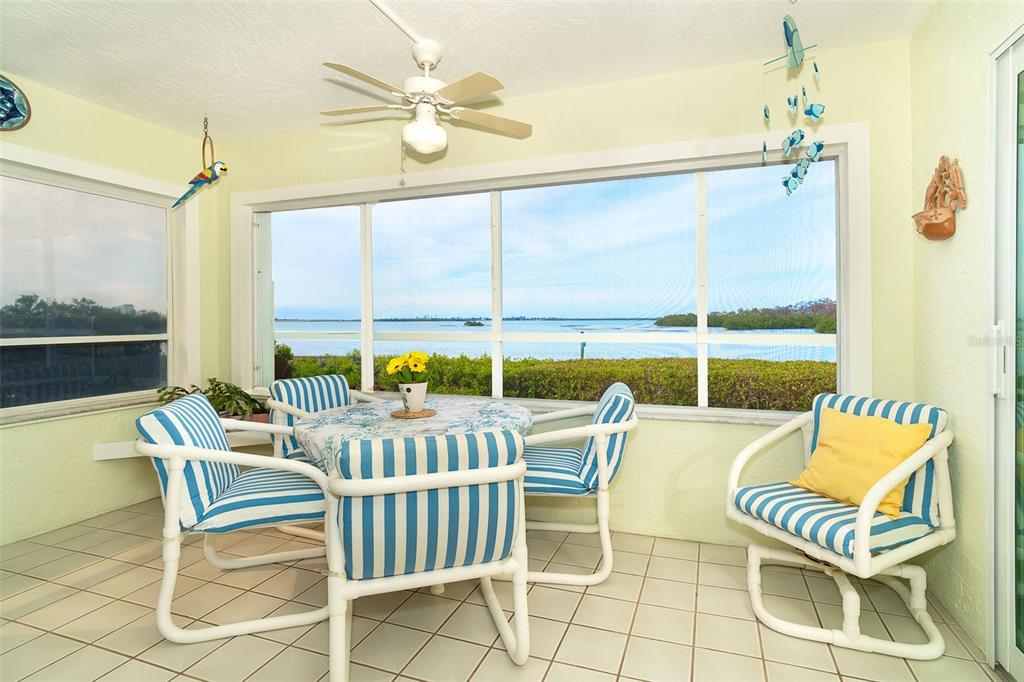 2424 Placida Road, Unit C101 Englewood, FL 34224 - Photo 23 of 65 a view of a chairs and a table in the balcony