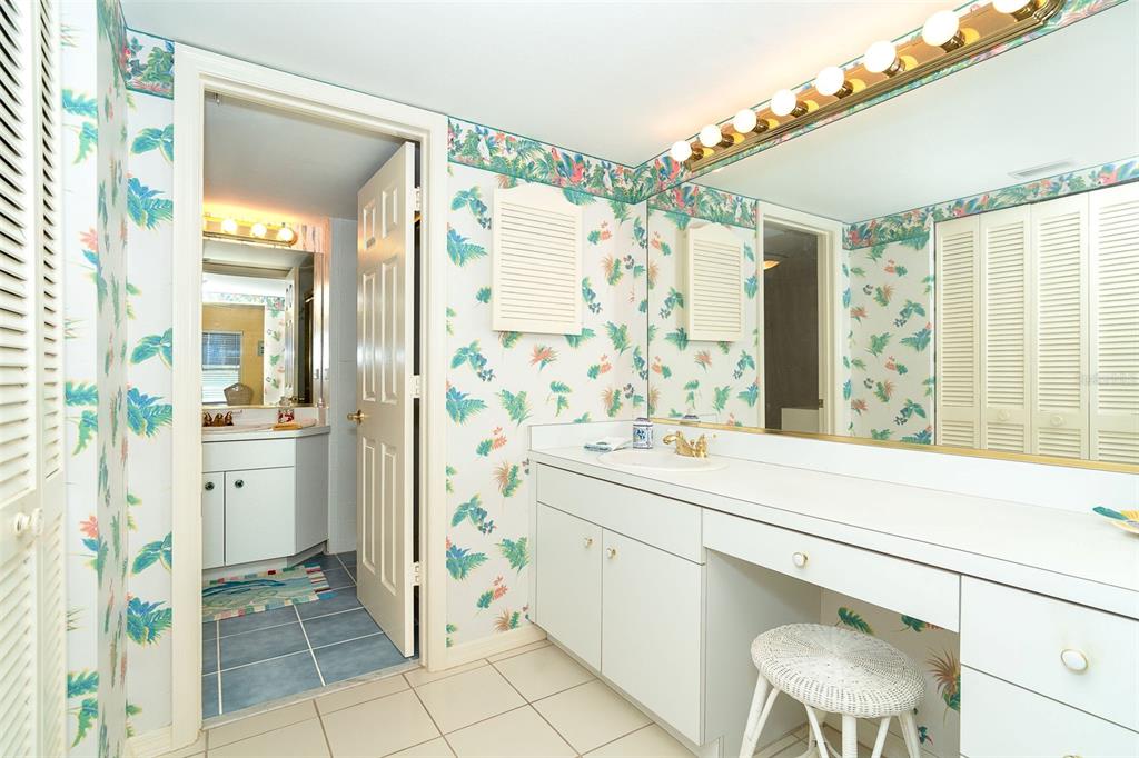 2424 Placida Road, Unit C101 Englewood, FL 34224 - Photo 29 of 65 a bathroom with a sink and a mirror