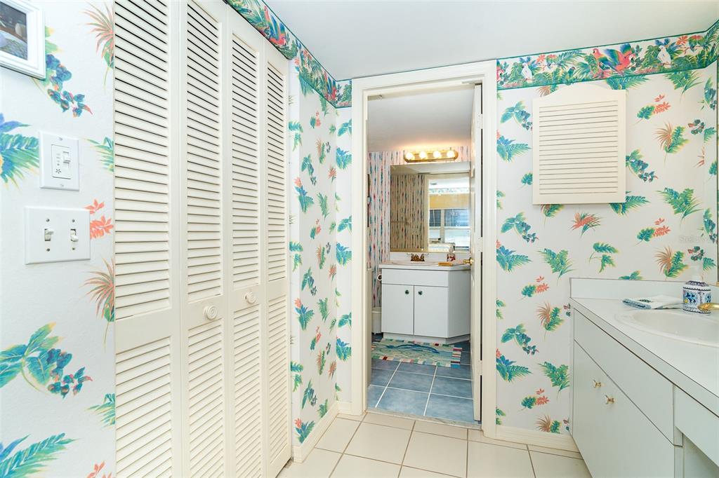 2424 Placida Road, Unit C101 Englewood, FL 34224 - Photo 30 of 65 a bathroom with a sink and a shower curtain