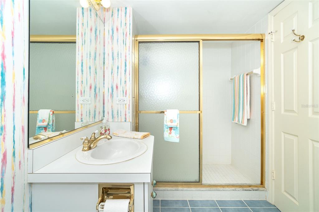 2424 Placida Road, Unit C101 Englewood, FL 34224 - Photo 32 of 65 a bathroom with a sink and a mirror