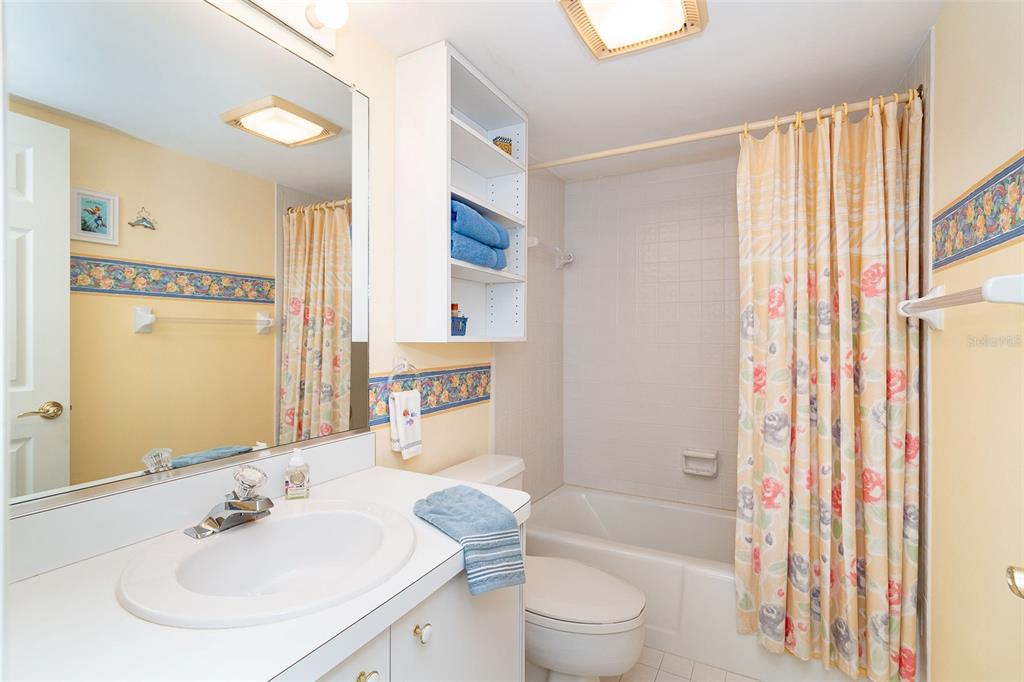 2424 Placida Road, Unit C101 Englewood, FL 34224 - Photo 35 of 65 a bathroom with a sink toilet and shower
