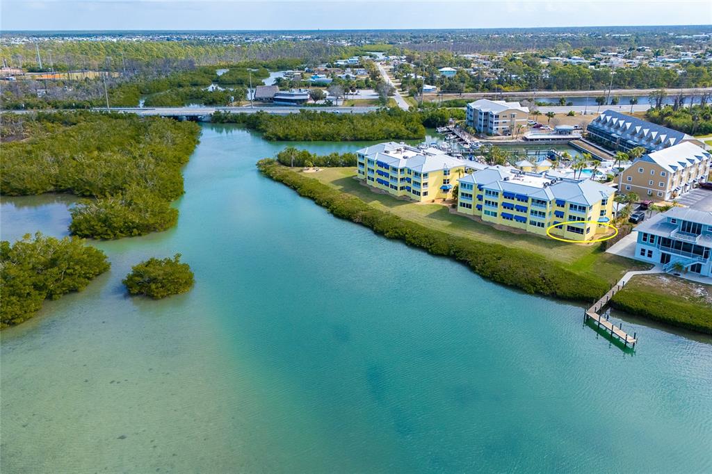 2424 Placida Road, Unit C101 Englewood, FL 34224 - Photo 4 of 65 an aerial view of lake residential houses with outdoor space and river