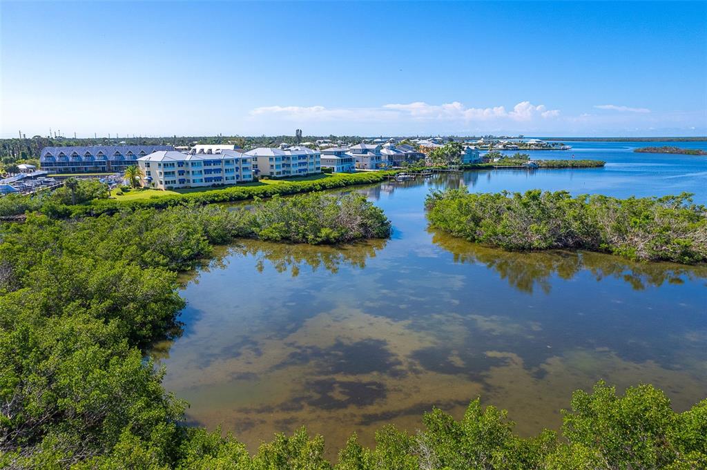 2424 Placida Road, Unit C101 Englewood, FL 34224 - Photo 42 of 65 a view of a lake with outdoor space