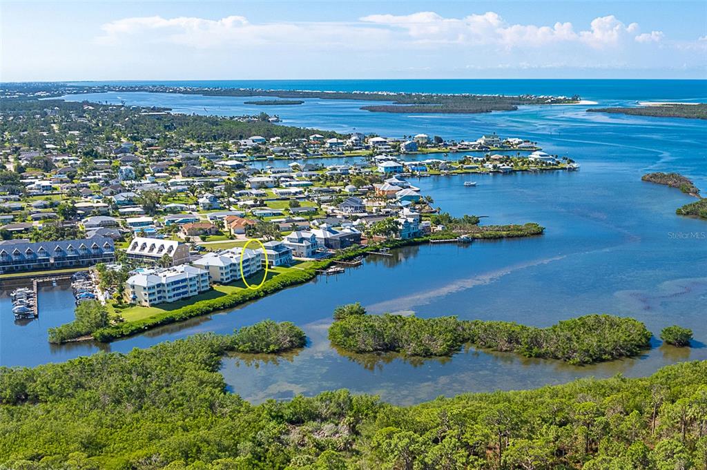 2424 Placida Road, Unit C101 Englewood, FL 34224 - Photo 45 of 65 an aerial view of ocean and residential houses with outdoor space