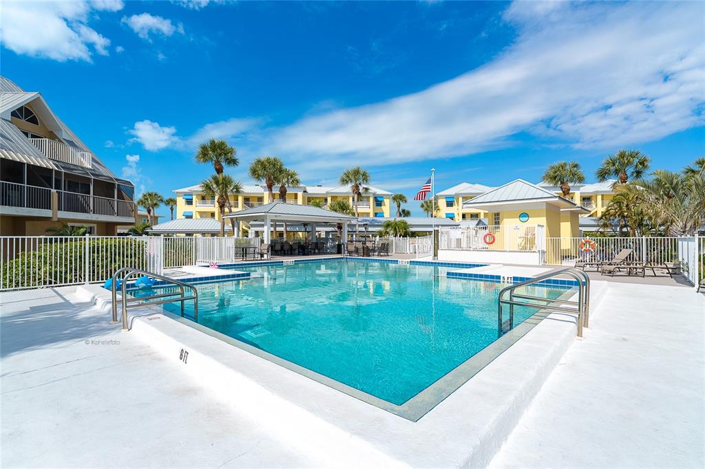 2424 Placida Road, Unit C101 Englewood, FL 34224 - Photo 48 of 65 a view of a swimming pool with a patio