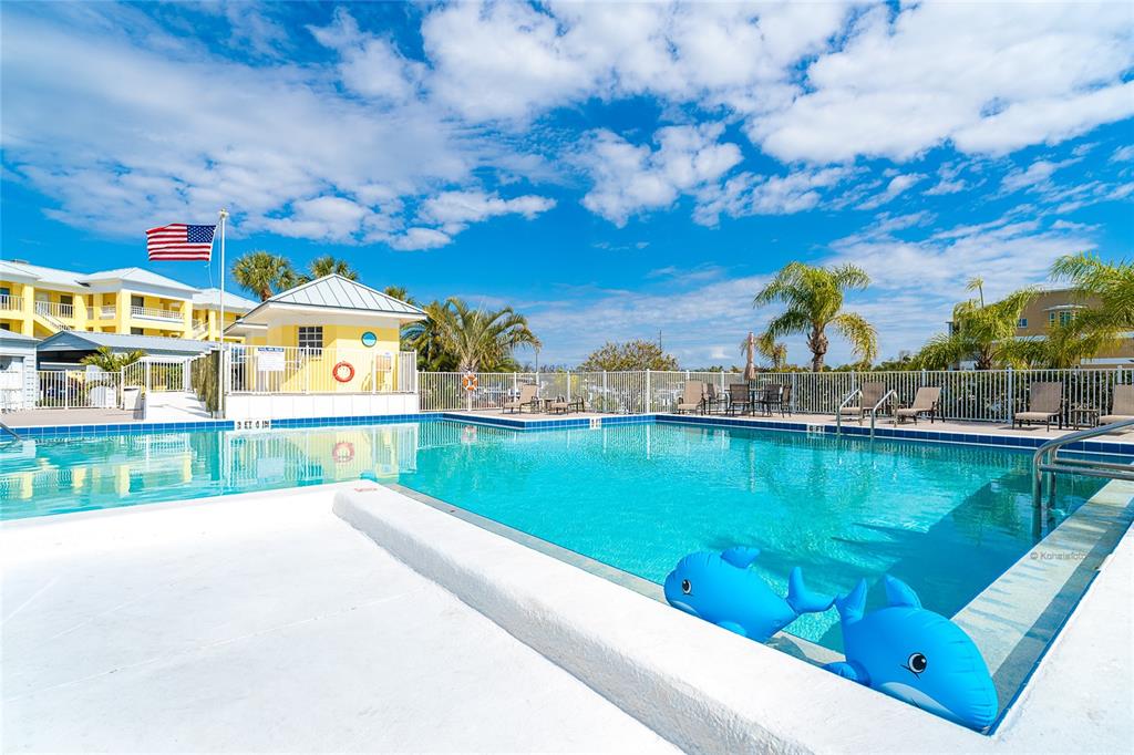 2424 Placida Road, Unit C101 Englewood, FL 34224 - Photo 49 of 65 a view of a swimming pool with outdoor space and seating area