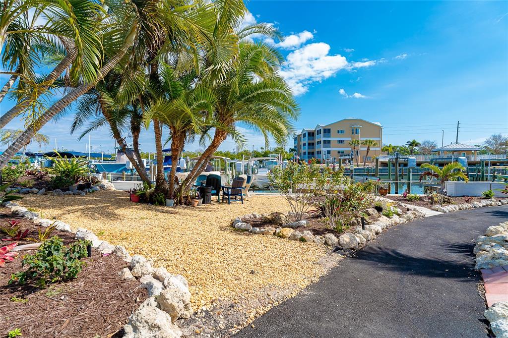 2424 Placida Road, Unit C101 Englewood, FL 34224 - Photo 55 of 65 a view of a park with large trees