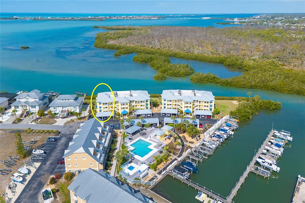 2424 Placida Road, Unit C101 Englewood, FL 34224 - Photo 59 of 65 a view of a city with an ocean