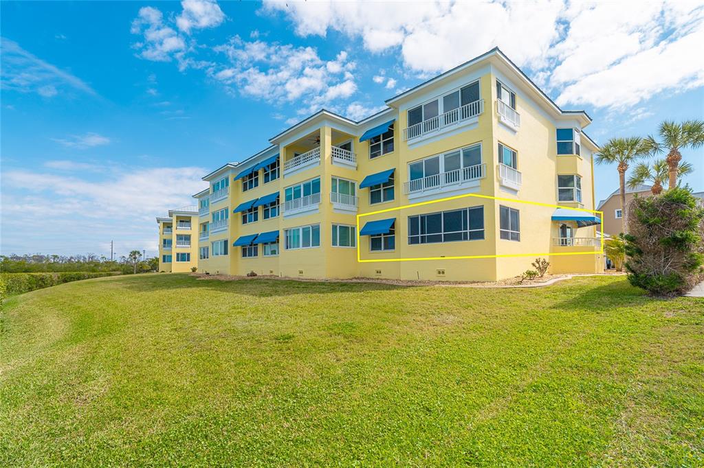 2424 Placida Road, Unit C101 Englewood, FL 34224 - Photo 64 of 65 a large building with a swimming pool