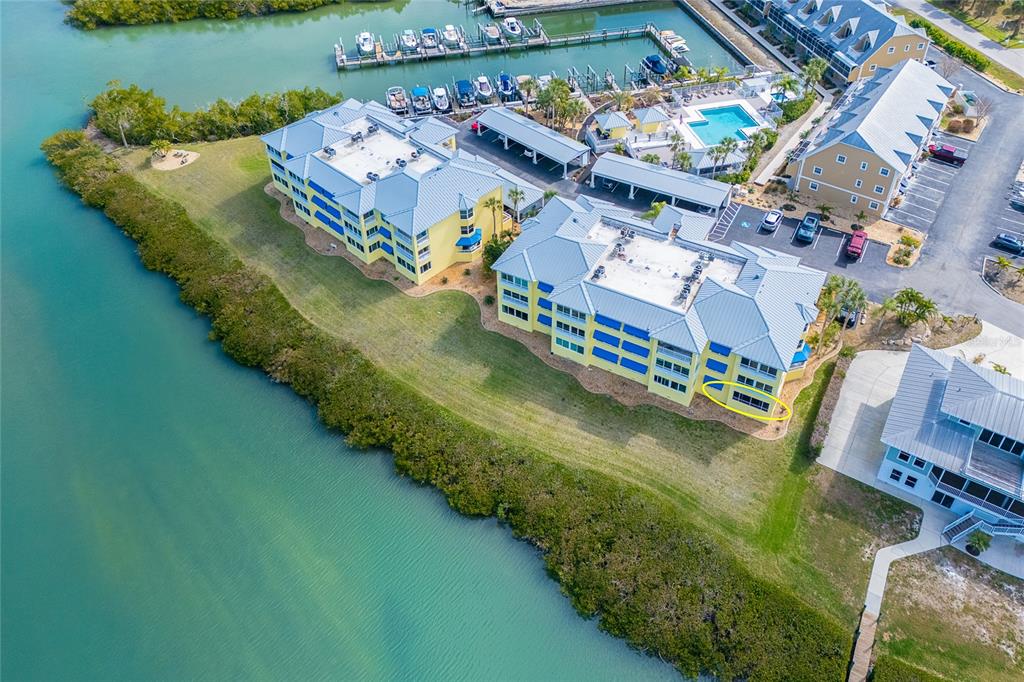 2424 Placida Road, Unit C101 Englewood, FL 34224 - Photo 65 of 65 an aerial view of a house a yard basket ball court and outdoor seating