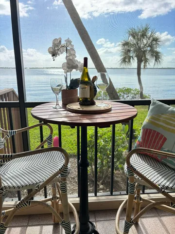 a view of a balcony with chairs