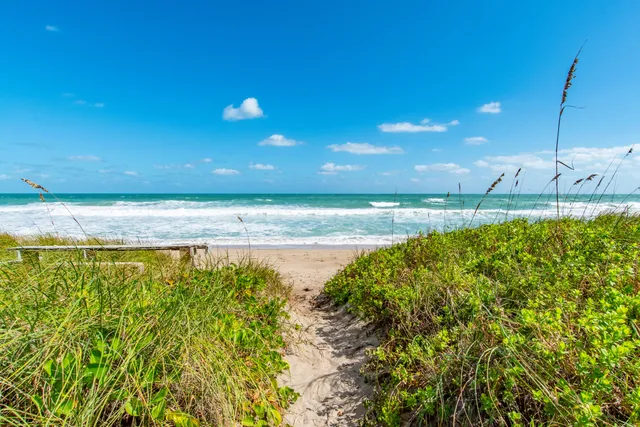a view of a swimming pool with an outdoor space and seating area