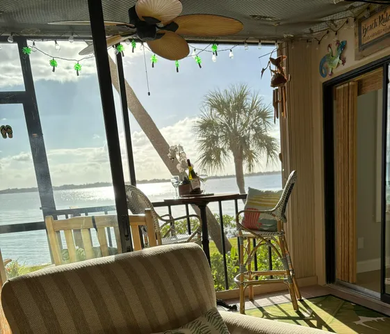 a view of a porch with seating space