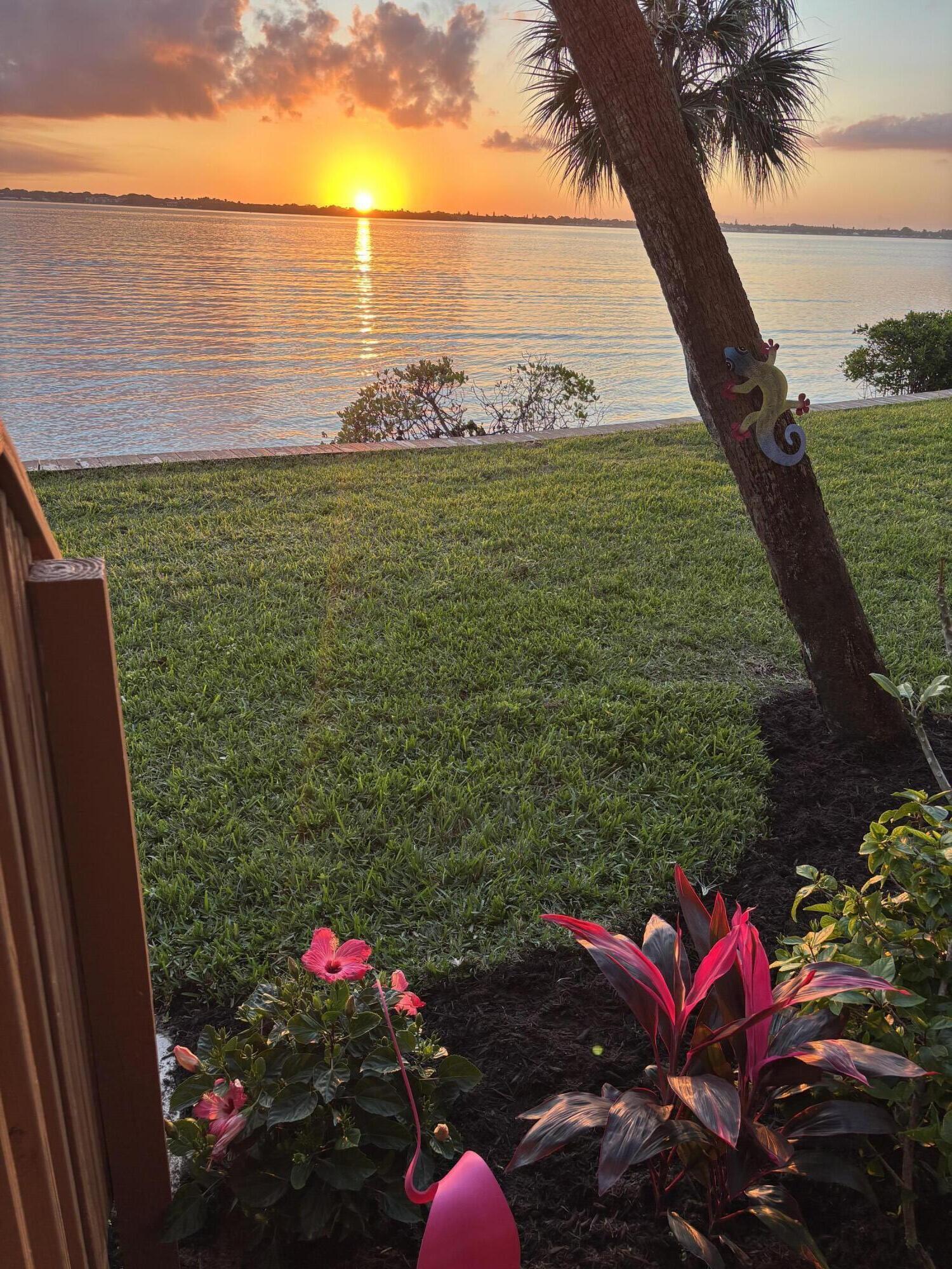 4440 Northeast Sandpebble Trace, Unit 104 Stuart, FL 34996 - Photo 28 of 33 a view of an outdoor space and a lake view