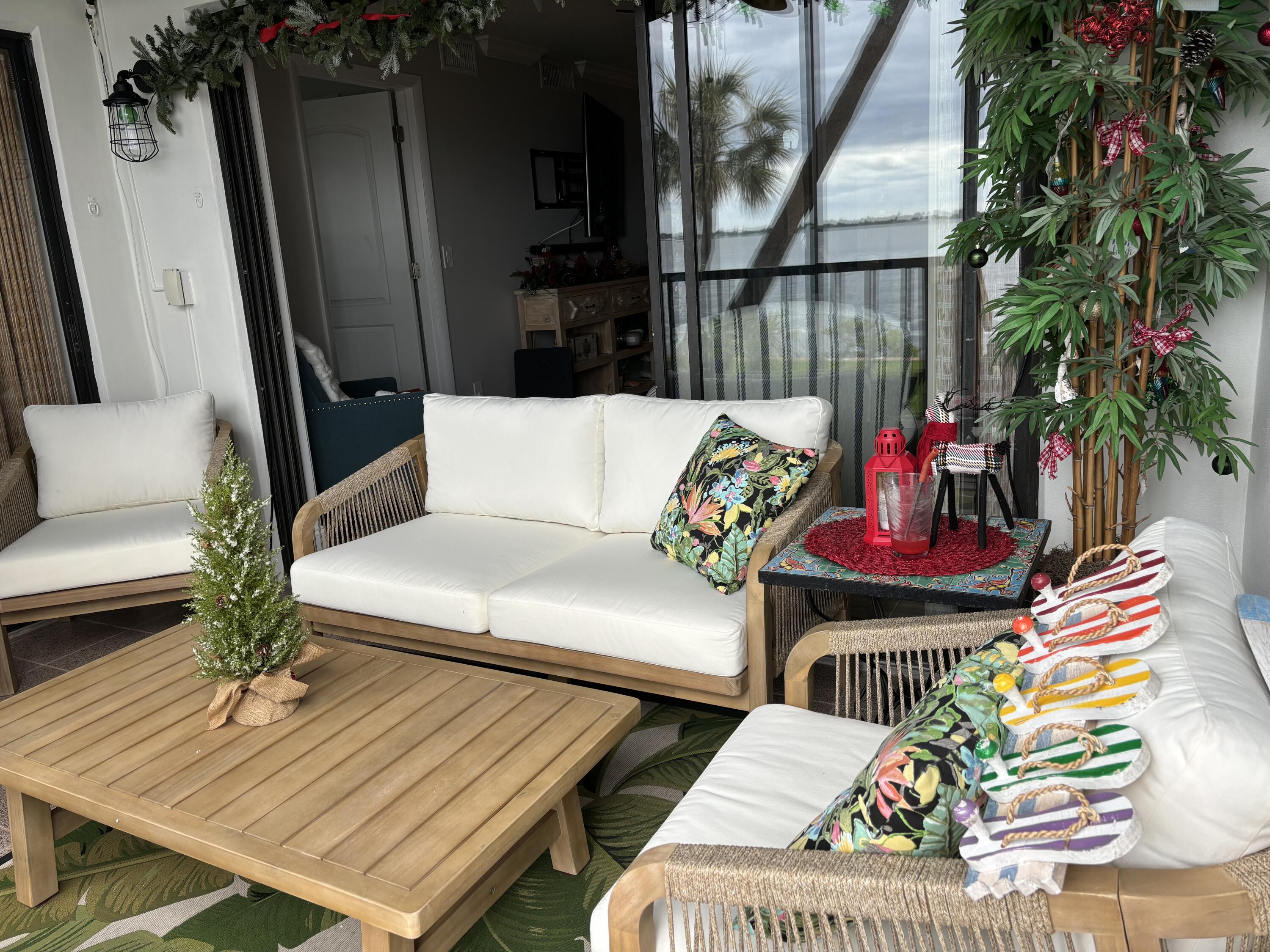 4440 Northeast Sandpebble Trace, Unit 104 Stuart, FL 34996 - Photo 32 of 33 wooden floor outdoor seating and living room