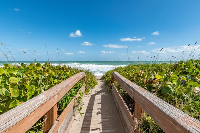 a view of balcony with wooden floor