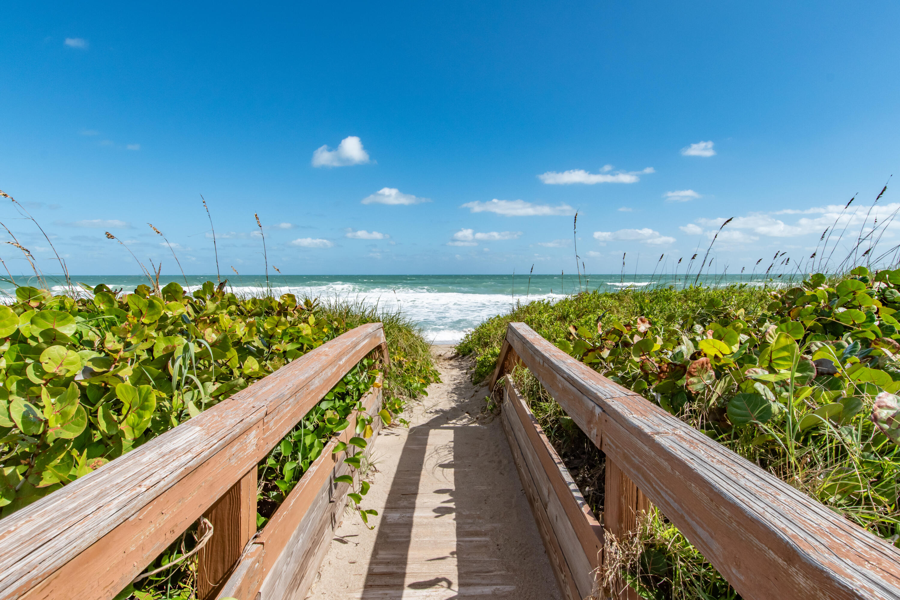 4440 Northeast Sandpebble Trace, Unit 104 Stuart, FL 34996 - Photo 9 of 33 a view of balcony with wooden floor