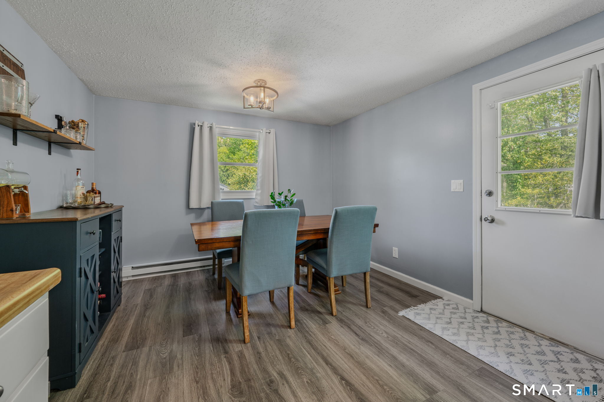 6 Amherst Court Groton, CT 06355 - Photo 12 of 40 a view of a dining room with furniture window and wooden floor