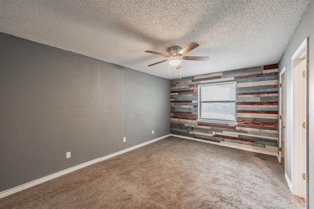 245 Gordon Drive Azle, TX 76020 - Photo 16 of 38 wooden floor in an empty room with a window