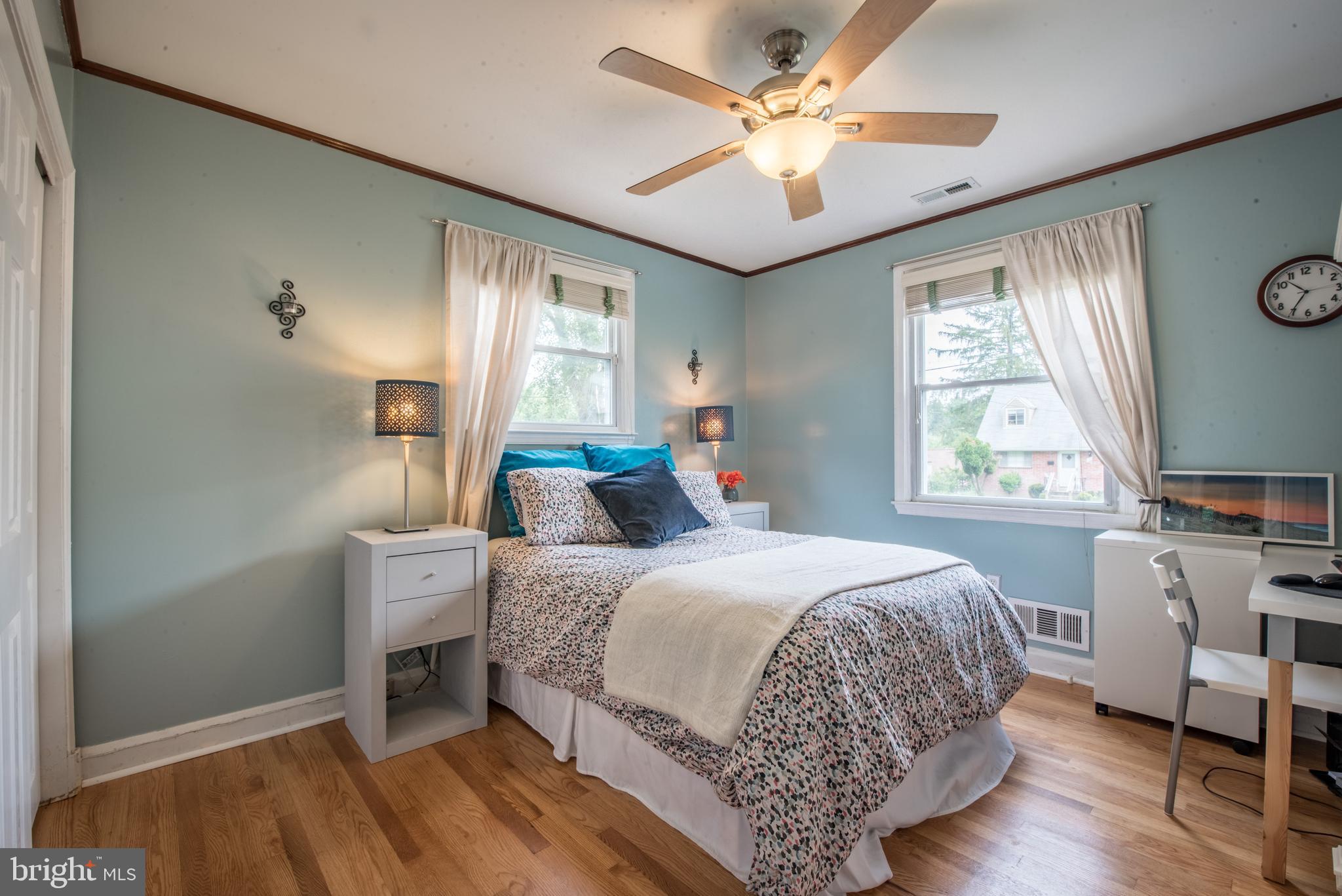 1346 Sudvale Road Baltimore, MD 21208 - Photo 16 of 30 a bedroom with a bed and a chandelier