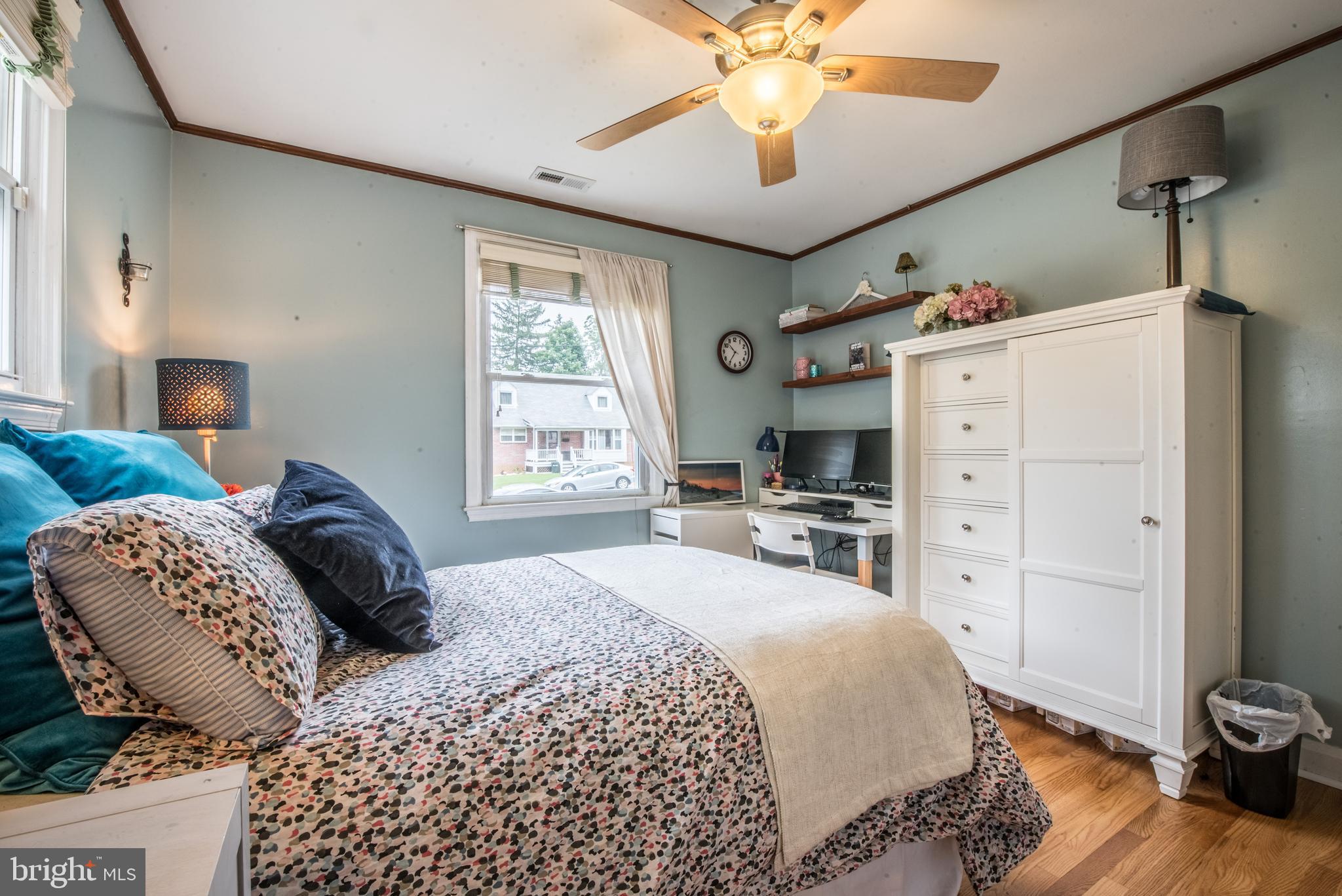 1346 Sudvale Road Baltimore, MD 21208 - Photo 17 of 30 a bedroom with a bed and a chandelier