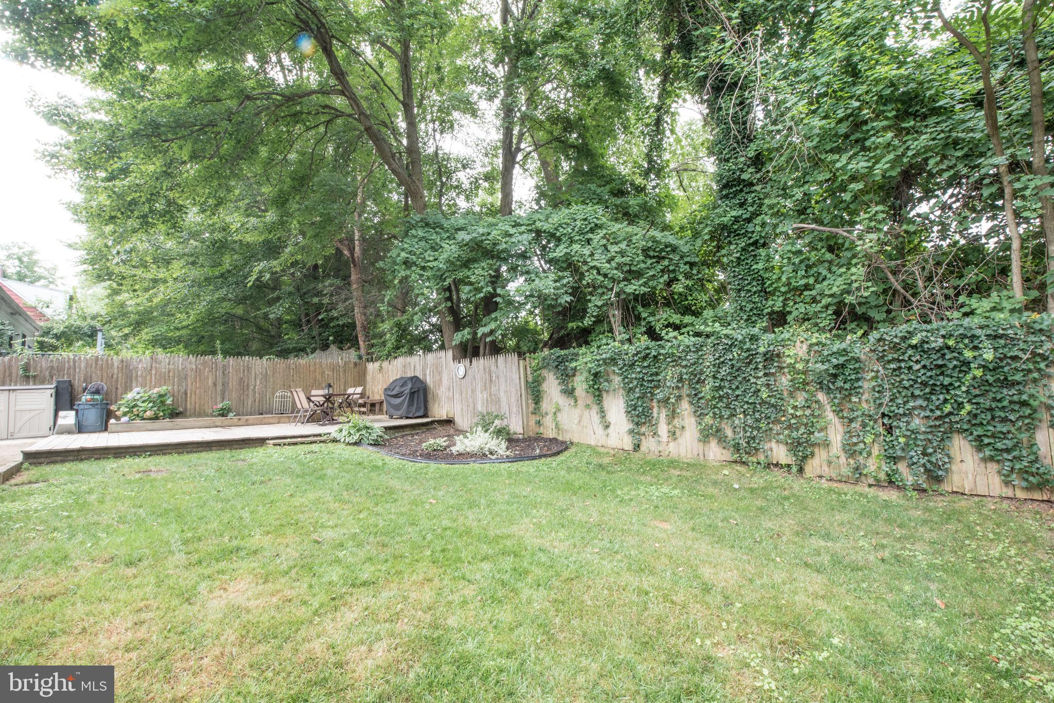 1346 Sudvale Road Baltimore, MD 21208 - Photo 28 of 30 a backyard of a house with table and chairs