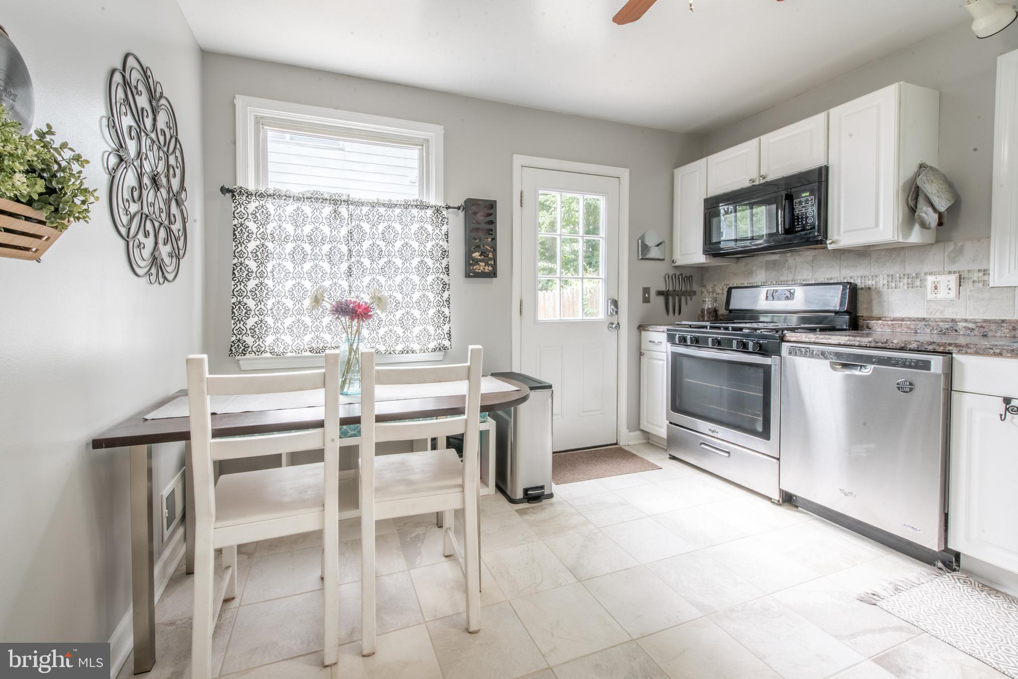 1346 Sudvale Road Baltimore, MD 21208 - Photo 10 of 30 a kitchen with a stove a sink and a refrigerator