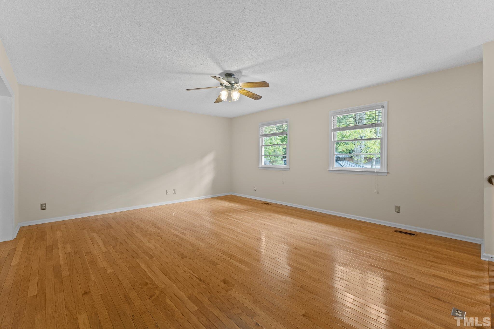 5101 Raintree Road Durham, NC 27712 - Photo 5 of 30 a view of an empty room with a window
