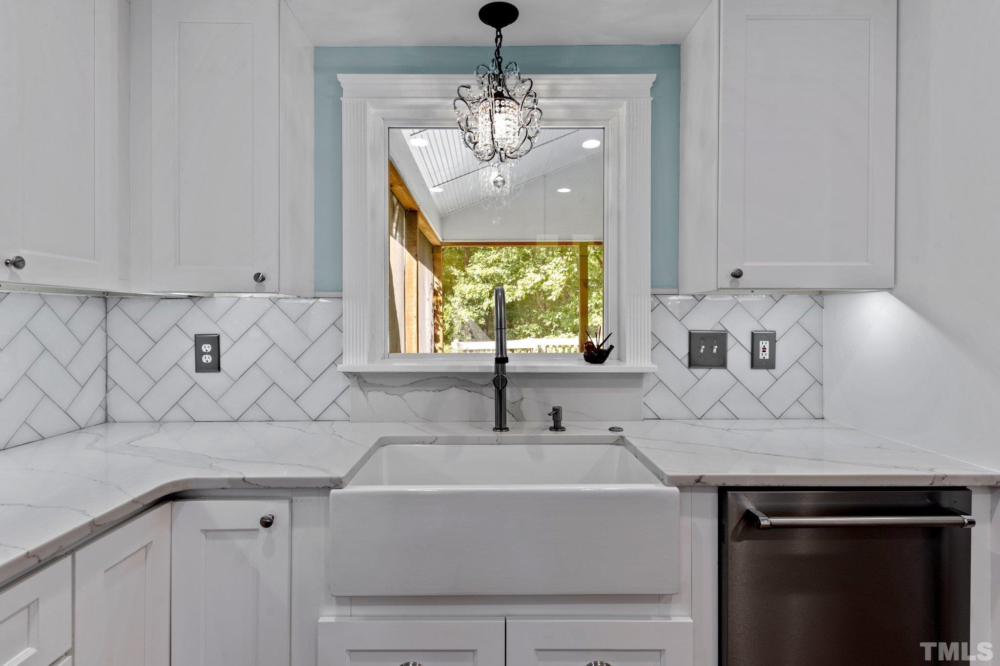 5101 Raintree Road Durham, NC 27712 - Photo 8 of 30 a bathroom with a sink and a mirror