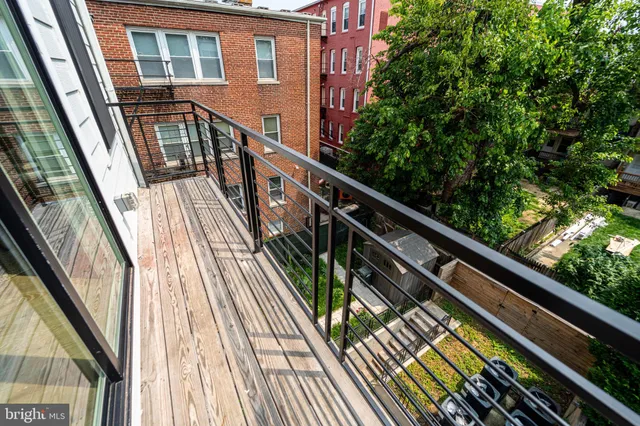 a view of balcony with wooden floor and stairs