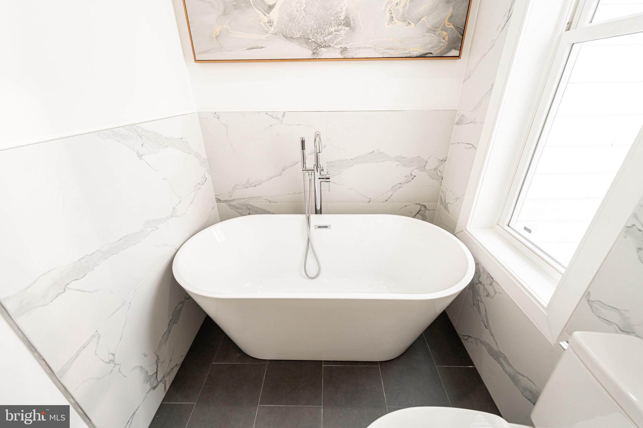 2517 Ontario Road Northwest, Unit PH8 Washington, DC 20009 - Photo 29 of 41 a view of a bathtub in a bathroom