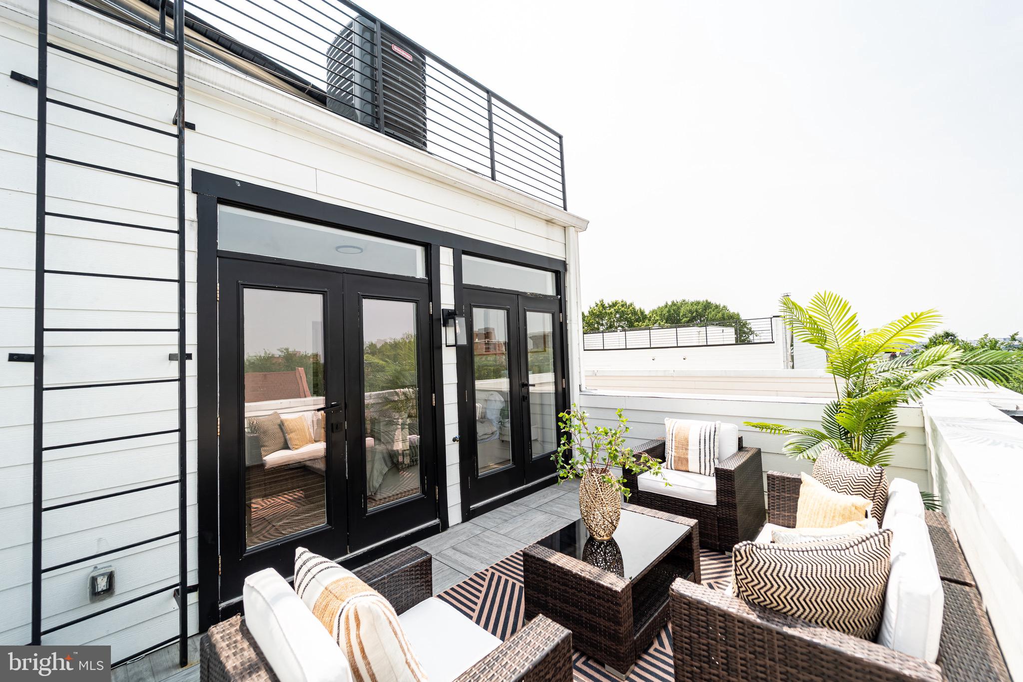 2517 Ontario Road Northwest, Unit PH8 Washington, DC 20009 - Photo 32 of 41 a outdoor living space with furniture