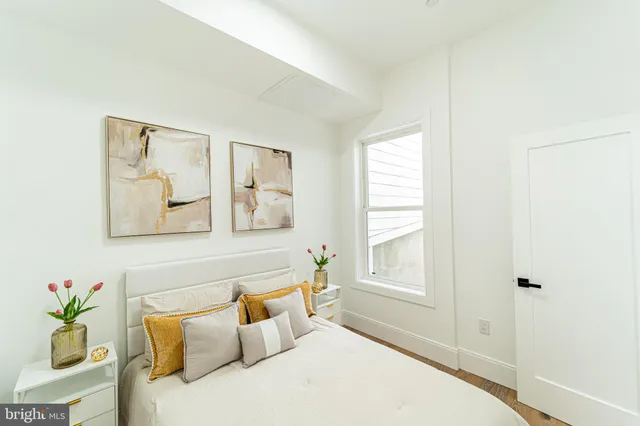 a bathroom with a sink toilet a mirror and shower