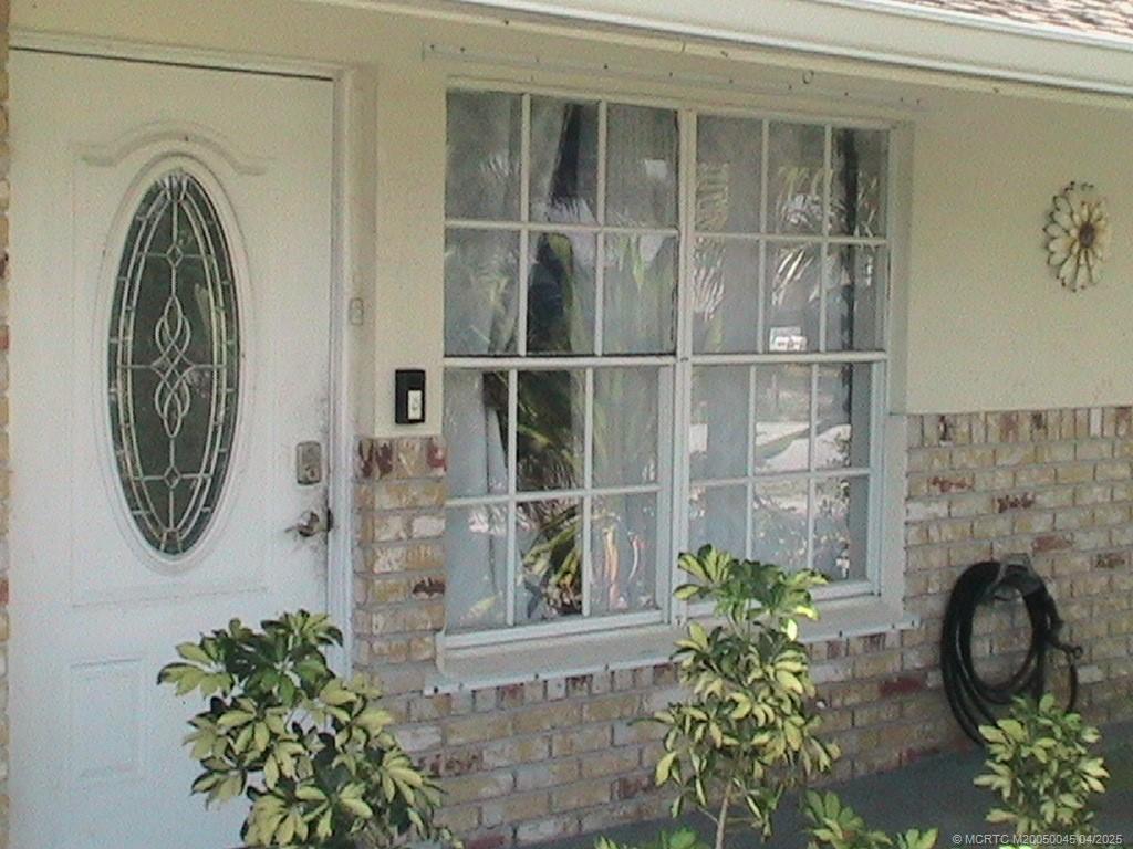 2340 Northeast Rustic Way Jensen Beach, FL 34957 - Photo 1 of 19 a close up of a mirror