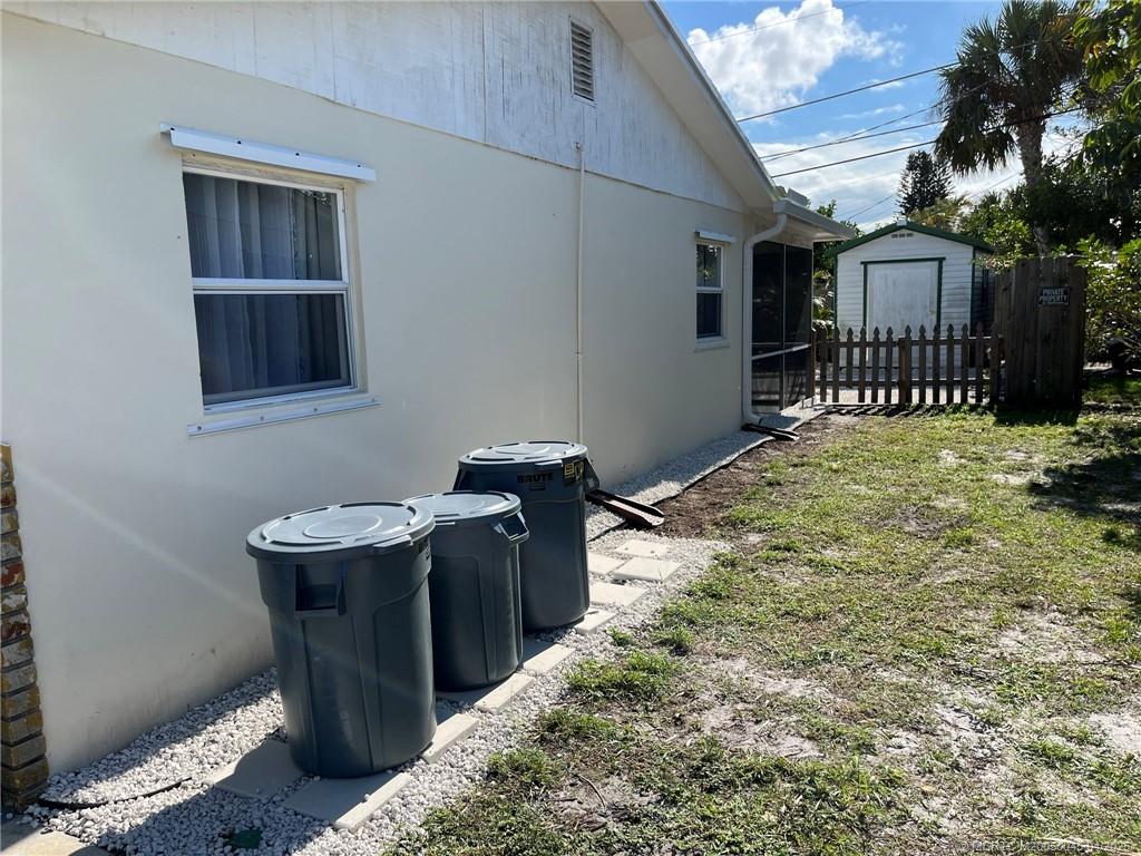 2340 Northeast Rustic Way Jensen Beach, FL 34957 - Photo 17 of 19 a balcony view with a sink and a table