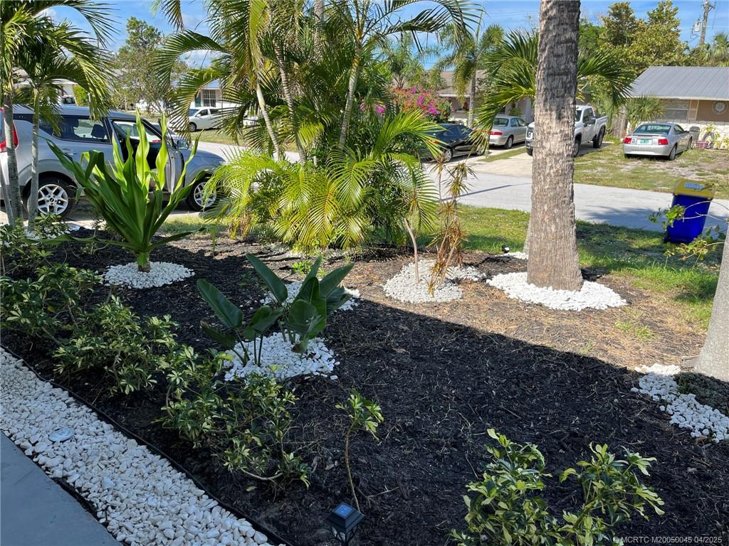 2340 Northeast Rustic Way Jensen Beach, FL 34957 - Photo 19 of 19 a view of a garden with plants