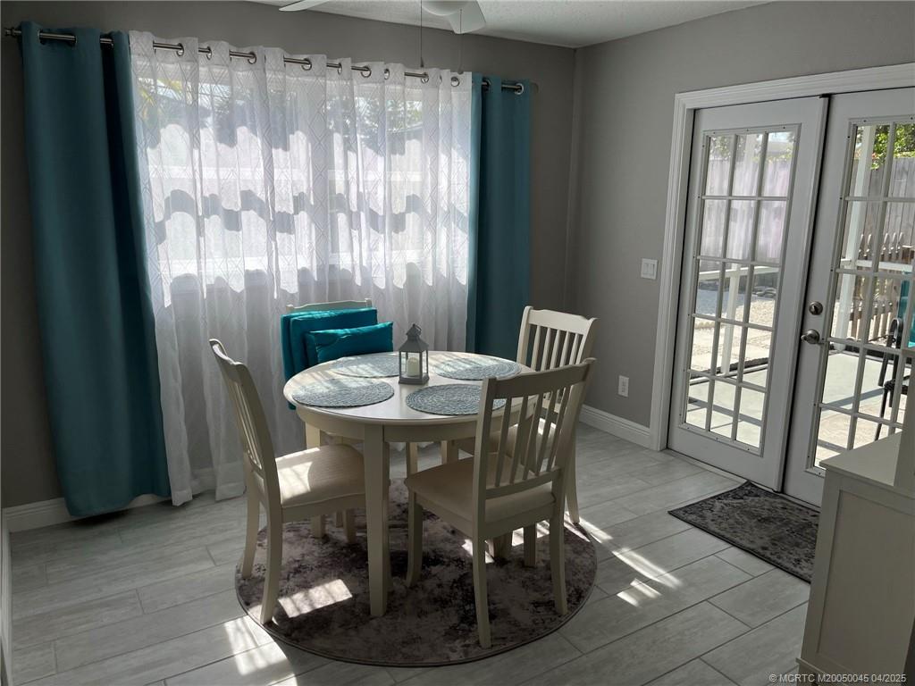 2340 Northeast Rustic Way Jensen Beach, FL 34957 - Photo 8 of 19 a dining room with furniture and window