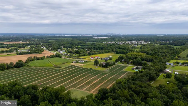 an aerial view of a city and mountain view in back