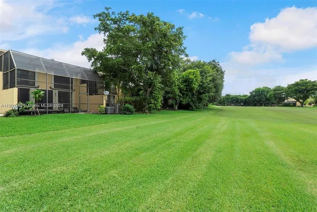 a view of a house with a big yard