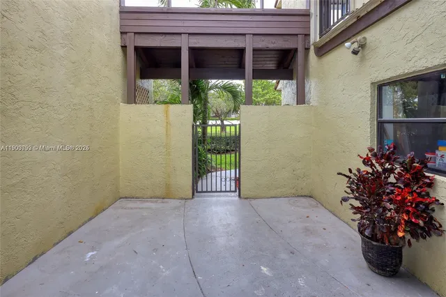 a view of a porch with a potted plant