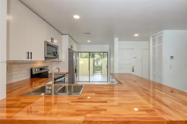 a view of a livingroom with a dinning table and chair