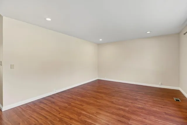 a bathroom with a granite countertop sink toilet a mirror and shower