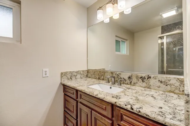 a front view of a house with yard patio and outdoor seating