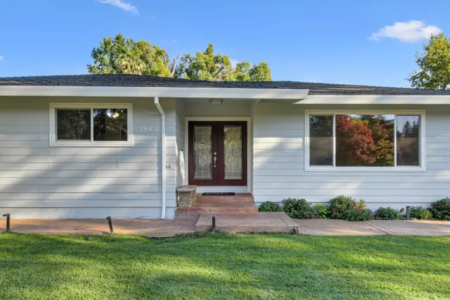front view of a house with a yard