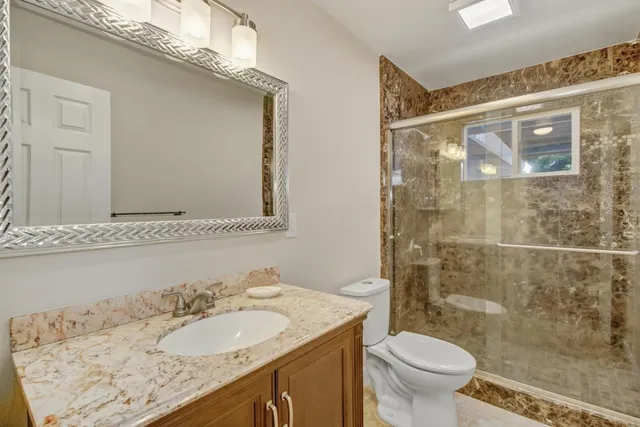 swimming pool view with a seating space