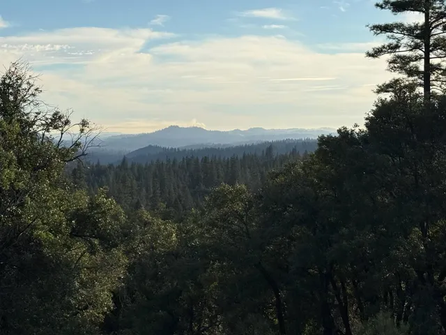 a view of mountain with lake view