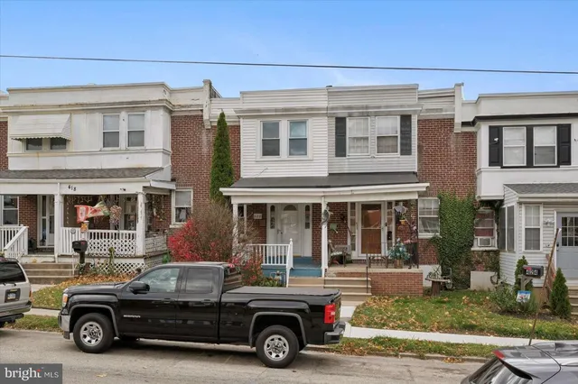 a car parked in front of a house