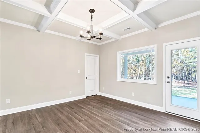 an empty room with ceiling fan